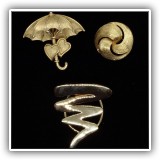 J113. Two Trifari gold tone pins and an unmarked gold tone scarf clip