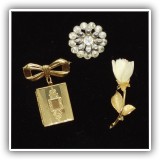 J115. Three gold tone pins