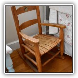 F50. Child-sized rocking chair with painted dog on back. 24"h - $38