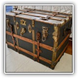 F47. Steamer trunk. 23"h x 34.5"w x 23"d - $250