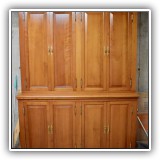 F64. Cherrywood cabinet matches desk in office. 83"h x 59.5w x 20"d - $600