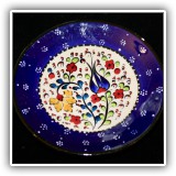 P40. Small blue and white dish with flowers. Some small chips on edge)