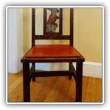 F42. Wooden child's chair with carved and painted bunny back and orange vinyl seat. 23.5"h x 12"w x 12.5"d - $45