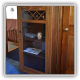 F43. Oak Mission style glass front cabinet 53.5"h x 25"w x 12"d - $375