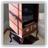 F65. Queen Anne style TV cabinet. Sun fading on one side and doors need re-attaching. 54"h x 35"w x 22"d - $150