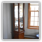F11. Lighted curio cabinet with mirrored back. 70.5"h x 25"w x 11"d - $150