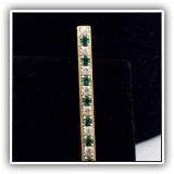J42. Goldtone bar bin with faux diamonds and emeralds. - $18