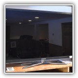 E10. Samsung UN55C6500 55" TV with swivel stand. - $175