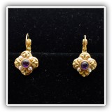 J57. Michal Golan earrings with faux pearls and purple stone. - $15