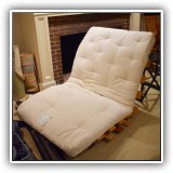 F73. Twin size futon with wooden frame. - $95