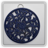 K15. Blue metal trivet. 7"w