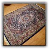D28. Hand knotted Oriental rug Measures approx. 5'6" x 4' - $450 